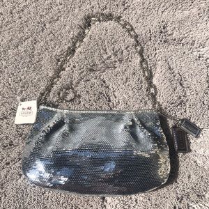 Coach sequence pouch.